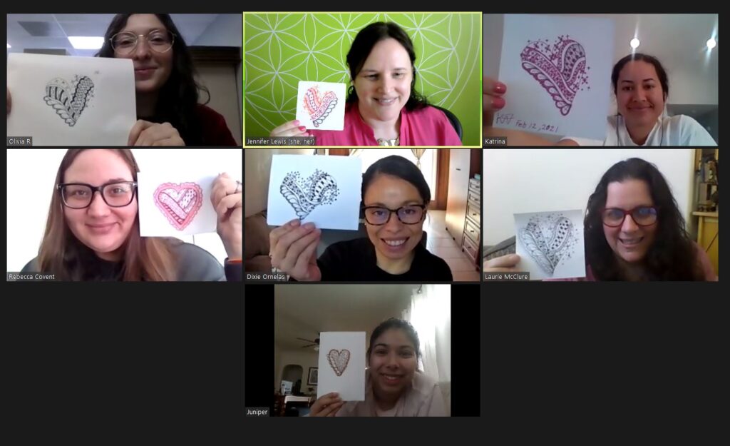 Eight participants on a video call, each holding up the Zentangle heart they drew